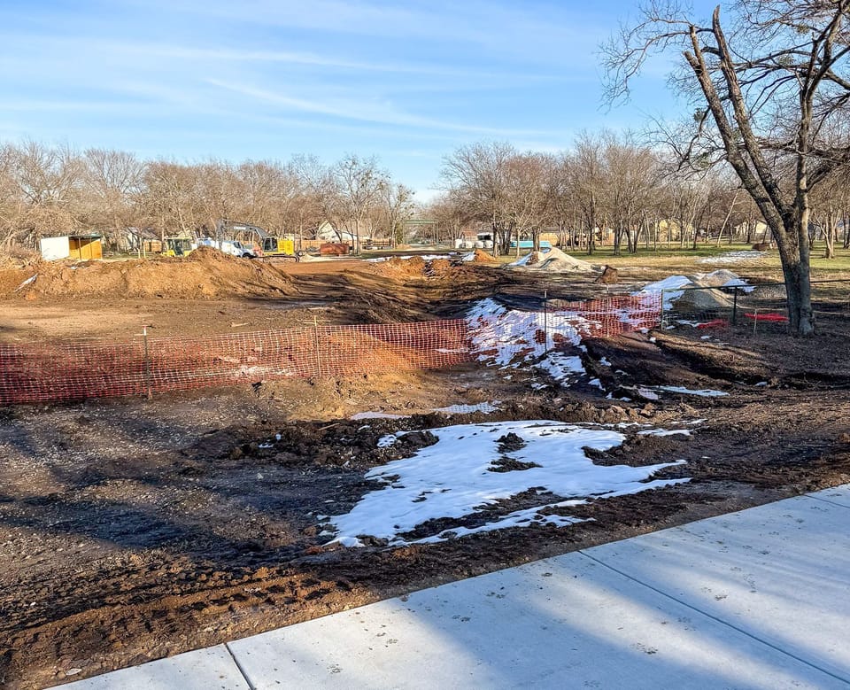 Work trucks working on drainage for Tennie Street project. 