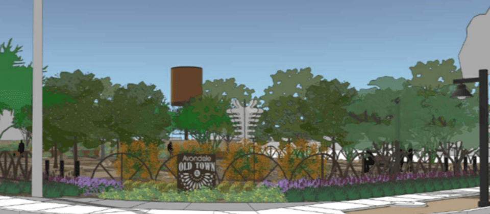 old town plaza sidewalk water tower trees.png