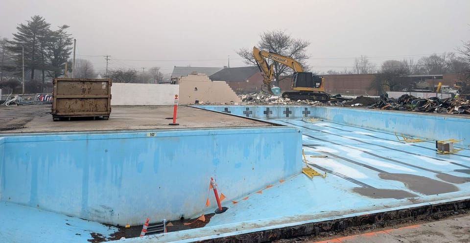 Demolition of the Kiwanis Pool bathhouse underway. 