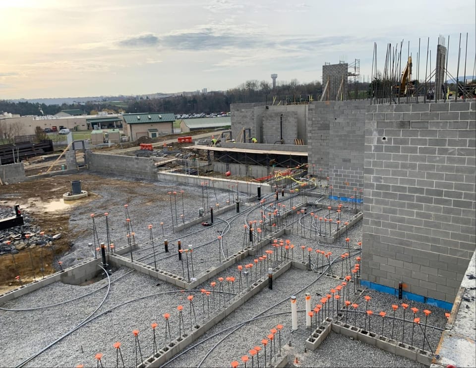Nov 2024 courthouse construction photo showing progress - foundation being poured and walls started