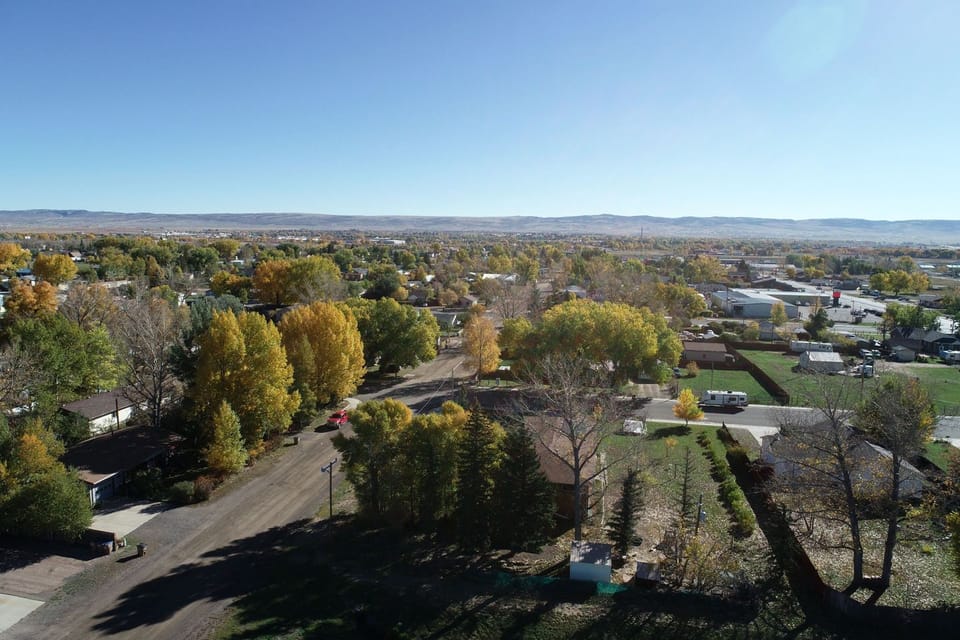 An overhead picture of West Laramie looking East with lots of trees with green leaves.