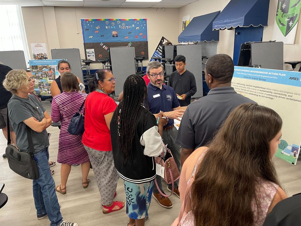 Project team member with residents at the phase 2 community workshop