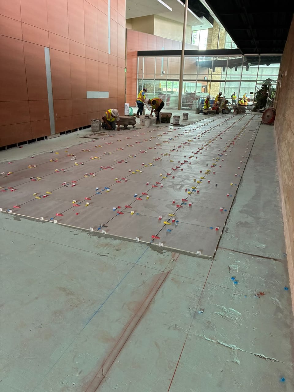 tiles being installed in lobby of recreation center
