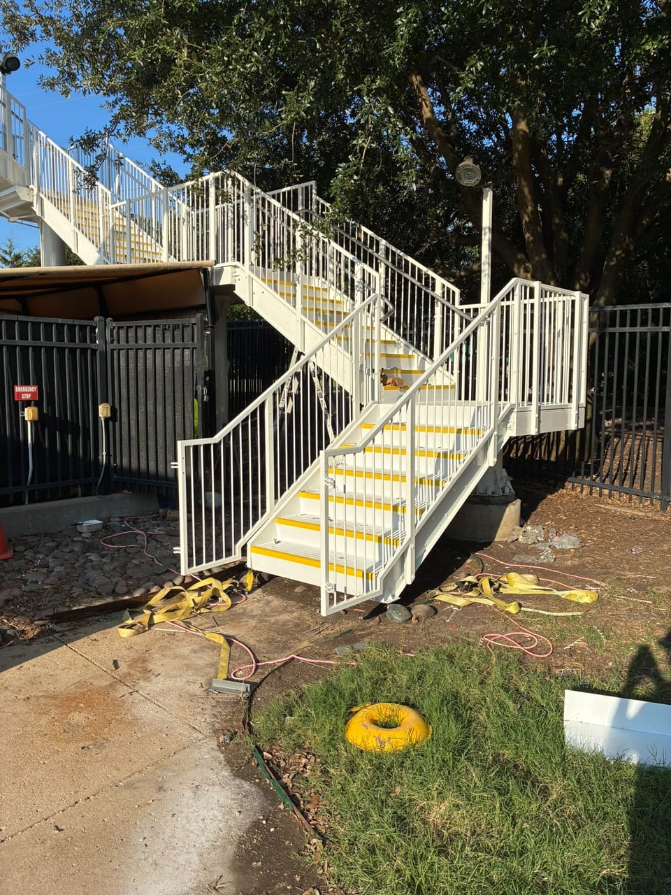 new white and yellow stairs at outside pool