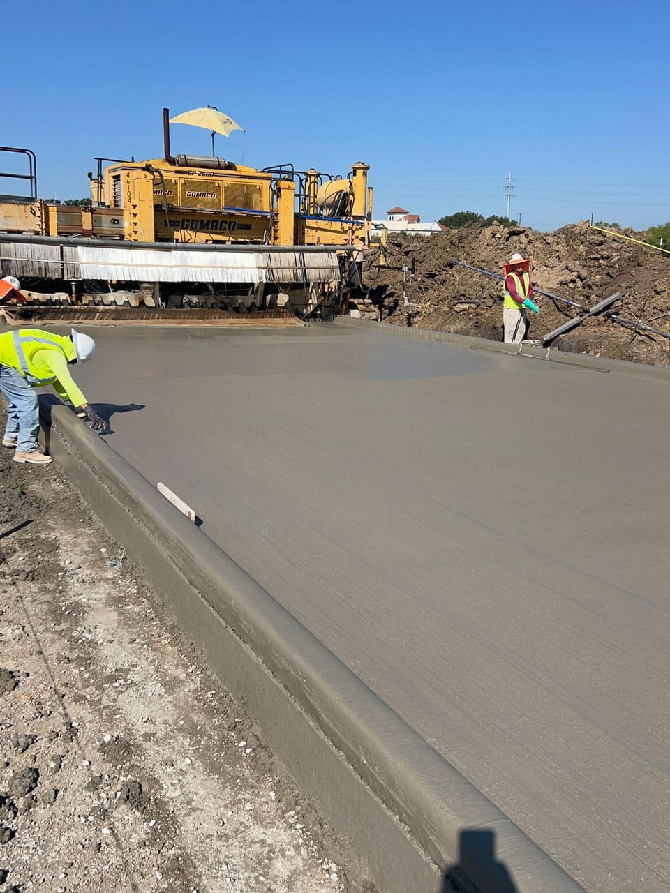 Construction crew laying concrete