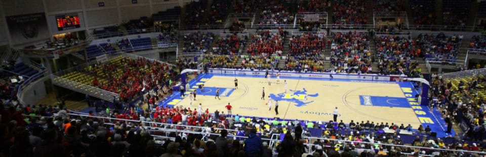 A wide shot of the Burton Coliseum during a basketball game