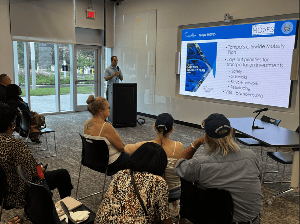 Robert Hatton shares information about Tampa M.O.V.E.S. during neighborhood meeting. 