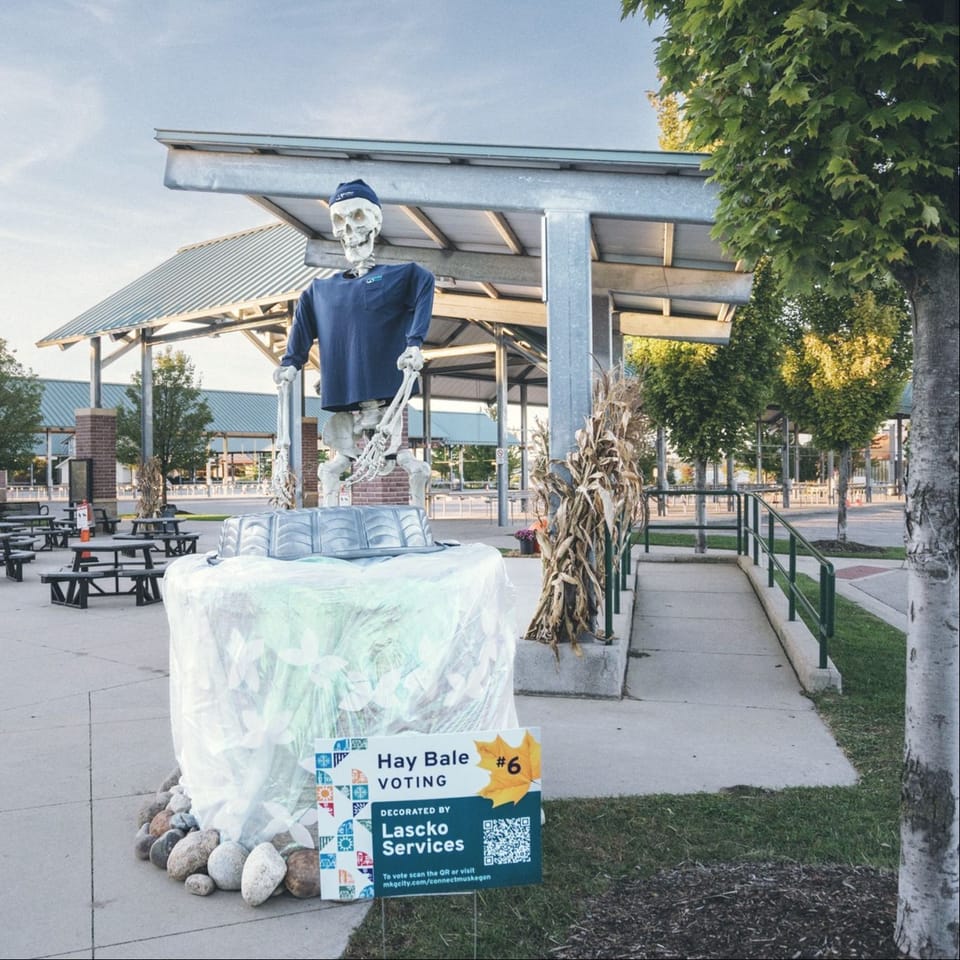 Large skeleton with a haybale wrapped to look like a firefly jar