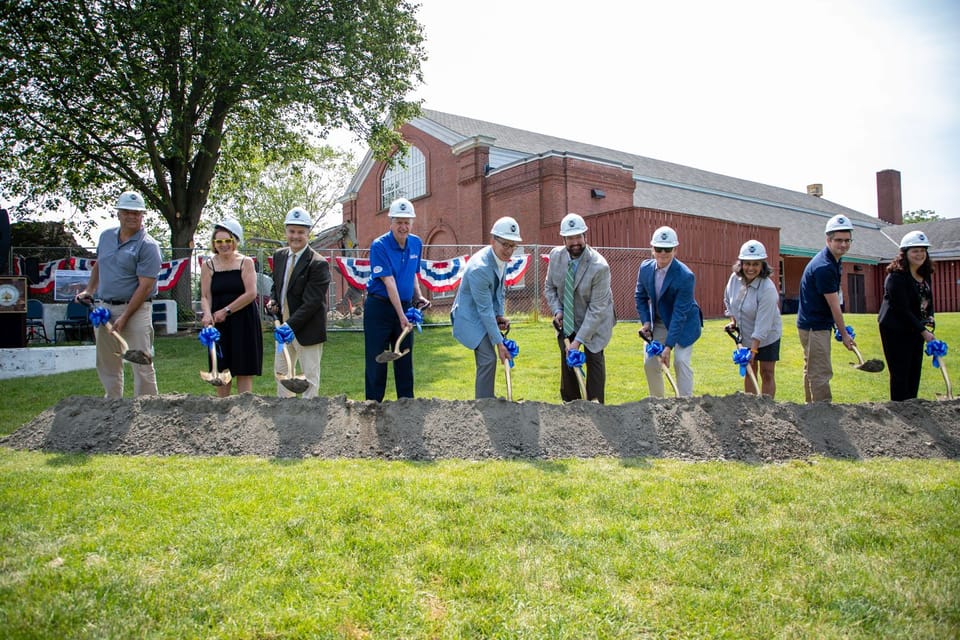 Groundbreaking ceremony, throwing dirt