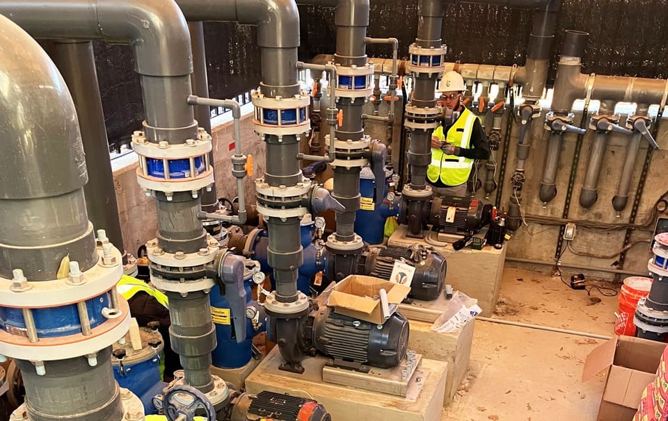 new pool pumps and motors in indoor pump room