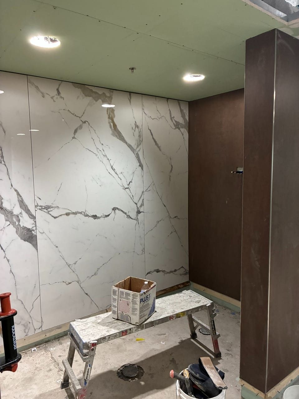 large tiled wall inside locker room