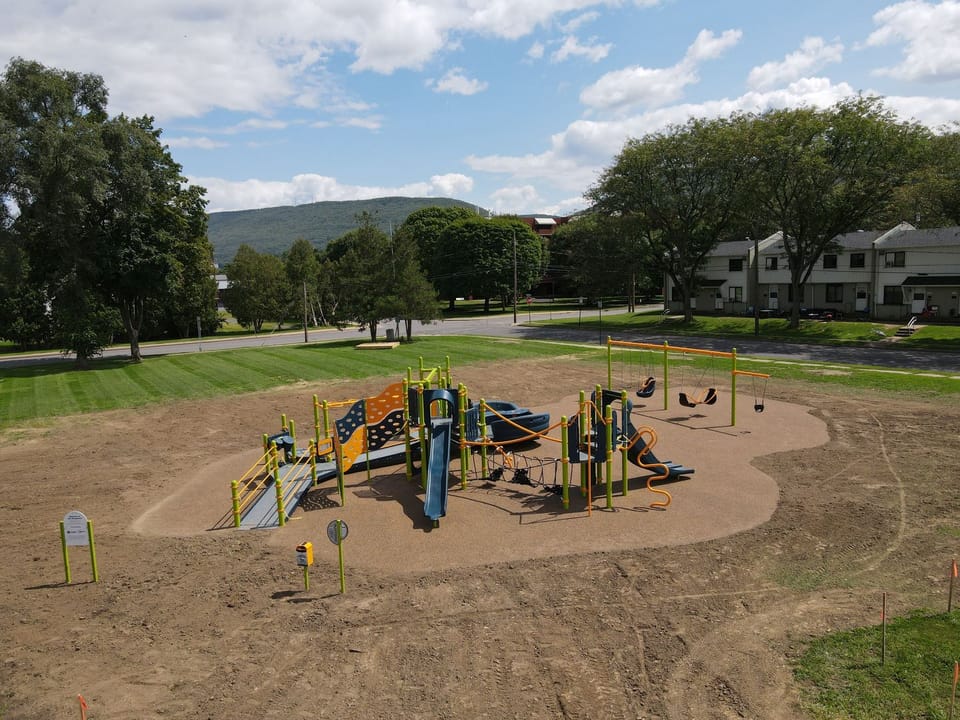 Hoberman Park Playground complete with slides, climbers, swings, and a zipline after construction in August 2024.