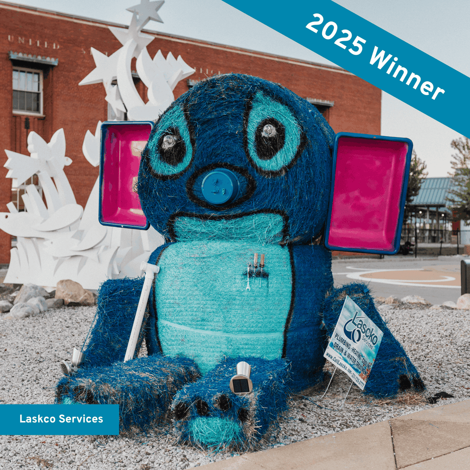 Hay bale stacked and decorated to look like Stitch