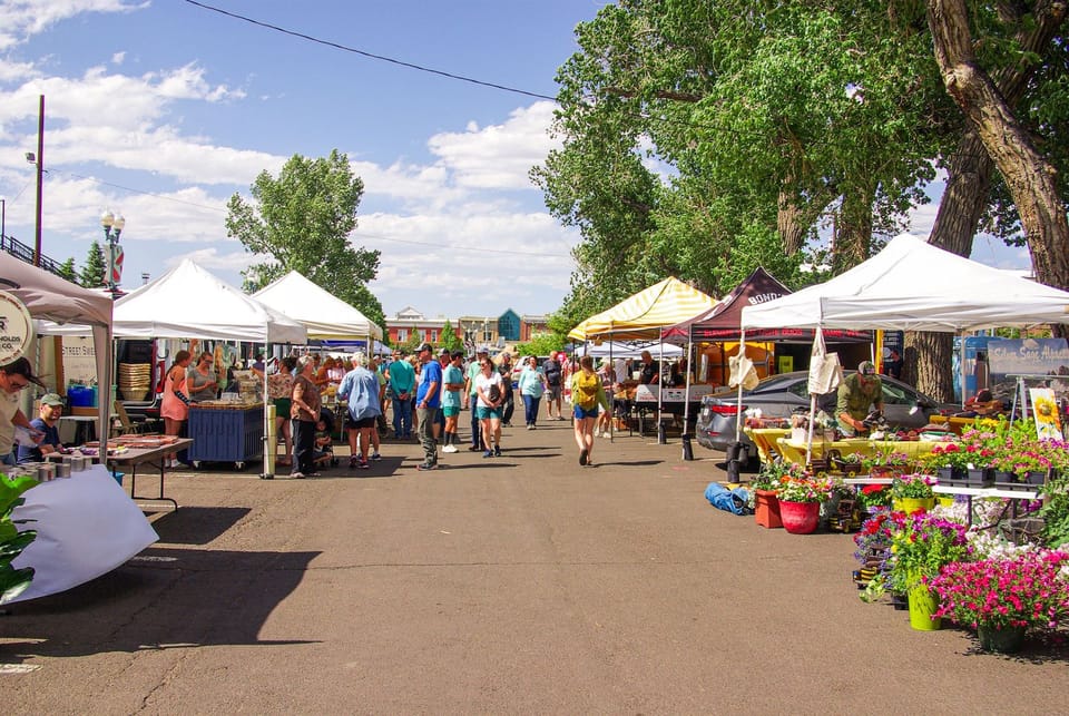 Image of a bustling Downtown Laramie Farmer's Market that was taken at one of the community outreach events.
