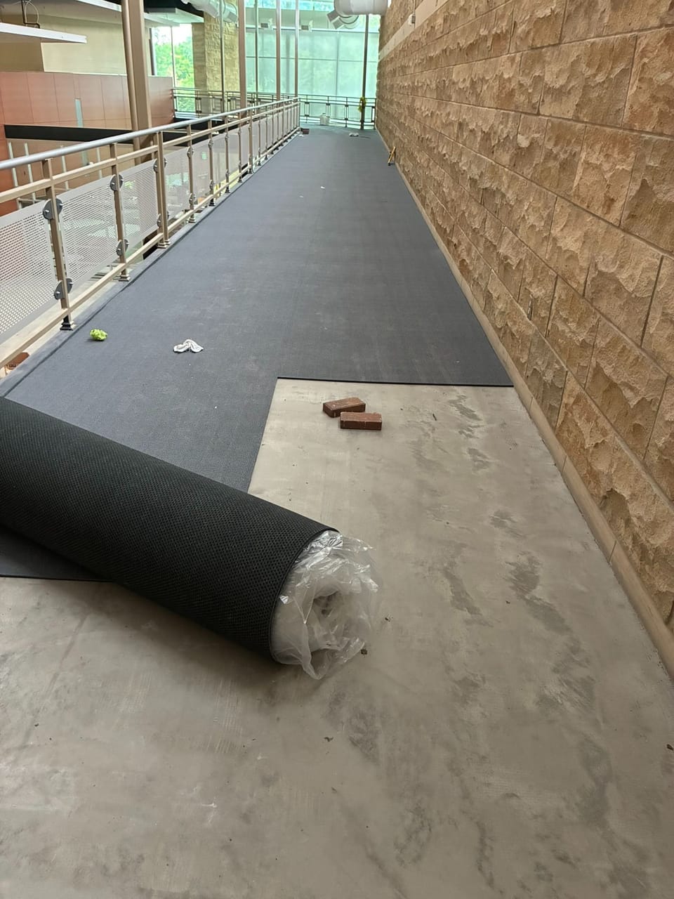 indoor walking track with surface being installed
