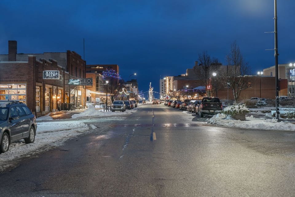 winter photo of street with holiday lights strung
