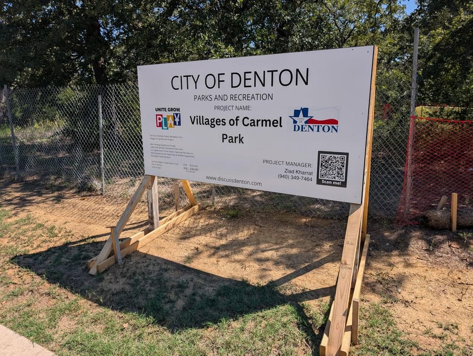 Photo of sign saying City of Denton parks and Recreation Project Name Village of Carmel Park