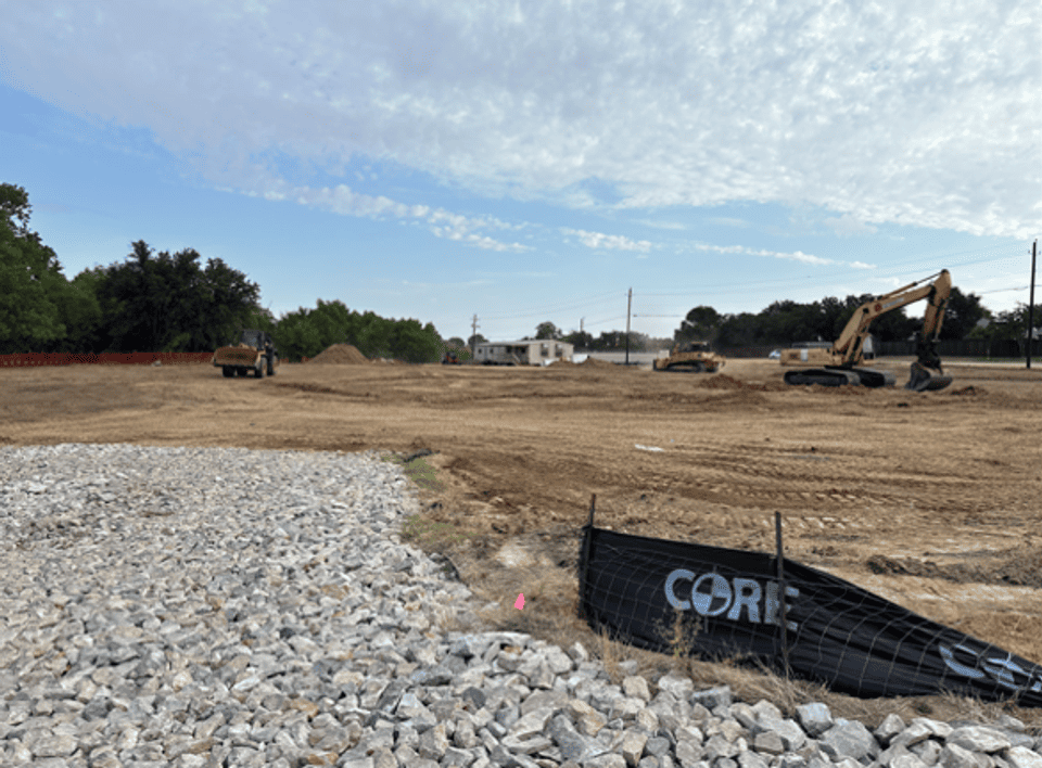 Photo of construction site being cleared with construction crew