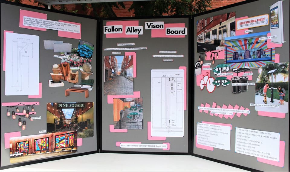 Photo of the display board showing the efforts taken to make the Fallon Alley project a reality including how the alley will look when work is complete.