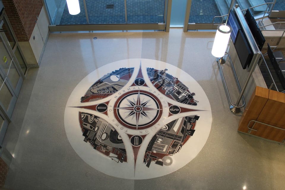 Image of the compass rose floor art that appears in Uptown Station. 