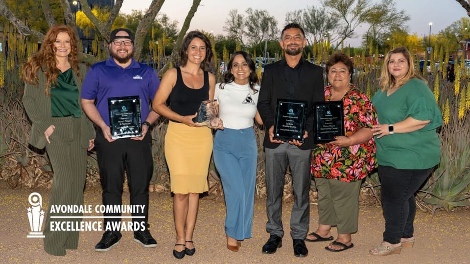 Avondale Community Excellence (ACE) Award winners photo of people holding the award plaque