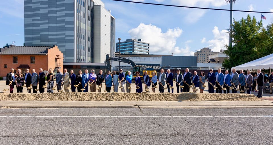 Local Officials holding shovels